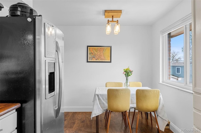 4544 W 65th Ave, Arvada, CO 80003 - dining area featuring baseboards and dark wood finished floors