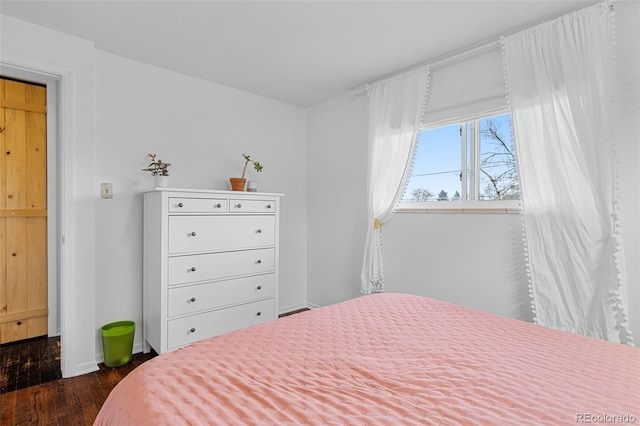 4544 W 65th Ave, Arvada, CO 80003 - bedroom featuring baseboards and dark wood finished floors