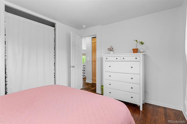 4544 W 65th Ave, Arvada, CO 80003 - bedroom featuring dark wood-type flooring and baseboards