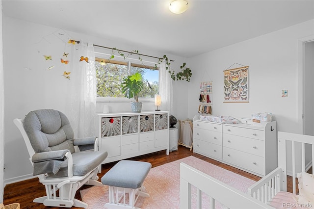 4544 W 65th Ave, Arvada, CO 80003 - bedroom featuring a crib and wood finished floors