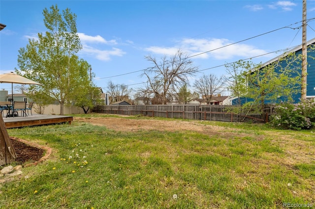 4544 W 65th Ave, Arvada, CO 80003 - view of yard featuring a deck and a fenced backyard