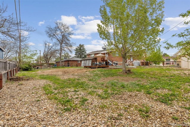 4544 W 65th Ave, Arvada, CO 80003 - view of yard with a deck and a fenced backyard