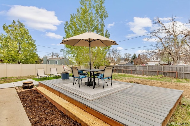 4544 W 65th Ave, Arvada, CO 80003 - wooden terrace featuring outdoor dining area and a fenced backyard