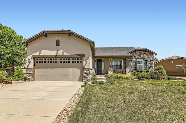 16550 Antero Cir, Broomfield, CO 80023 - view of front of property with stone siding, stucco siding, an attached garage, a front yard, and driveway