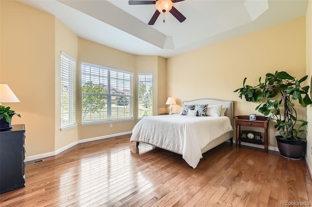 16550 Antero Cir, Broomfield, CO 80023 - bedroom with wood finished floors, baseboards, a raised ceiling, and ceiling fan