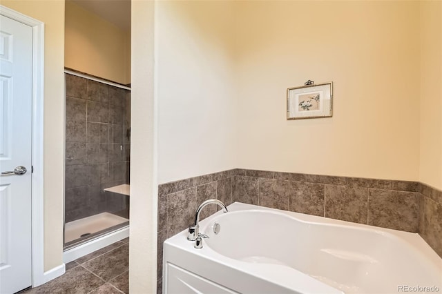16550 Antero Cir, Broomfield, CO 80023 - full bathroom featuring a garden tub, a shower stall, and tile patterned flooring