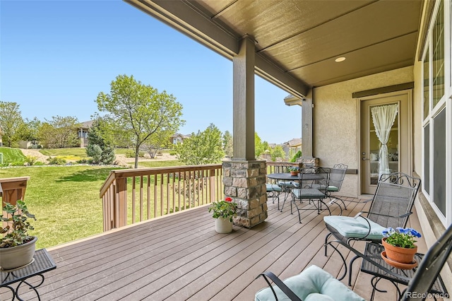 16550 Antero Cir, Broomfield, CO 80023 - wooden deck with a yard and outdoor dining area