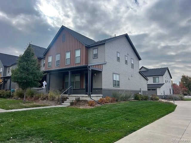 view of front facade featuring a front lawn and covered porch