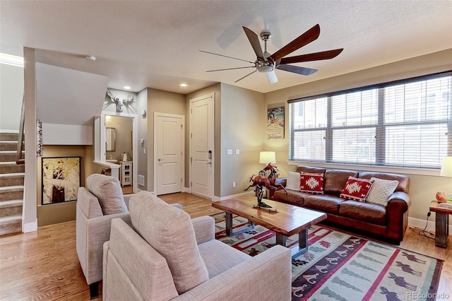 13713 Raritan Ln, Broomfield, CO 80023 - living room featuring a ceiling fan, light wood-style floors, stairway, and recessed lighting
