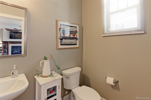 13713 Raritan Ln, Broomfield, CO 80023 - half bathroom featuring toilet and a sink