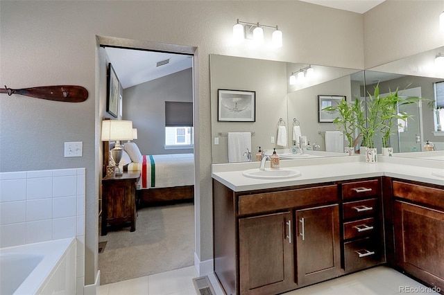 13713 Raritan Ln, Broomfield, CO 80023 - ensuite bathroom with double vanity, tile patterned floors, and a garden tub