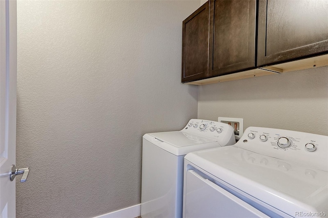 13713 Raritan Ln, Broomfield, CO 80023 - laundry area with cabinet space, washer and clothes dryer, and a textured wall