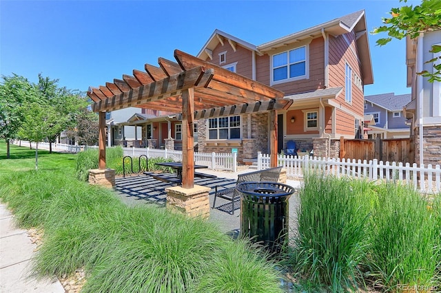 13713 Raritan Ln, Broomfield, CO 80023 - rear view of property featuring a pergola and stone siding