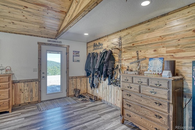 1625 Black Cloud Cir, Westcliffe, CO 81252 - foyer entrance featuring wood walls, wainscoting, wood finished floors, a textured ceiling, and recessed lighting