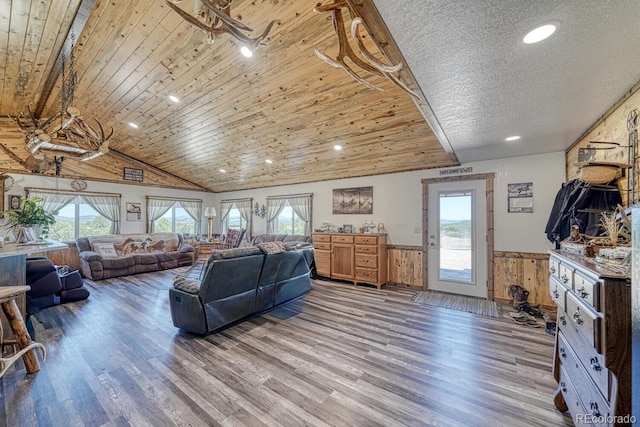 1625 Black Cloud Cir, Westcliffe, CO 81252 - living room featuring wainscoting, wood finished floors, wooden ceiling, wood walls, and recessed lighting