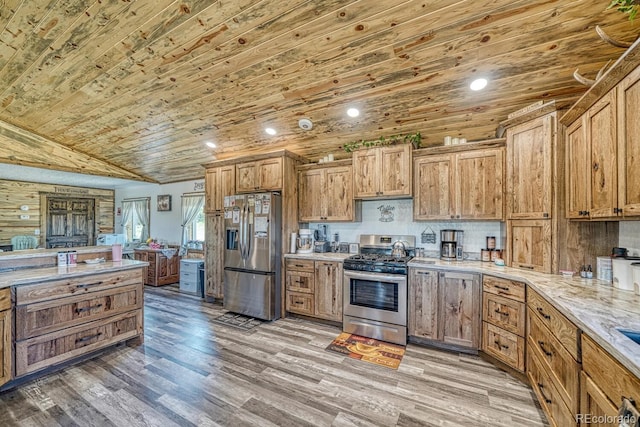 1625 Black Cloud Cir, Westcliffe, CO 81252 - kitchen with stainless steel appliances, wood ceiling, light wood finished floors, brown cabinets, and vaulted ceiling
