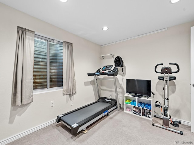 exercise area featuring carpet flooring