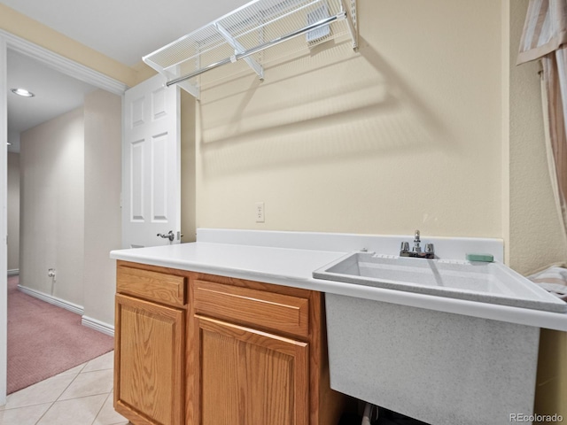 laundry area with light tile patterned flooring