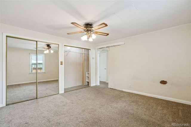 1175 Xanthia, Denver, CO 80220 - unfurnished bedroom with two closets, carpet flooring, and ceiling fan