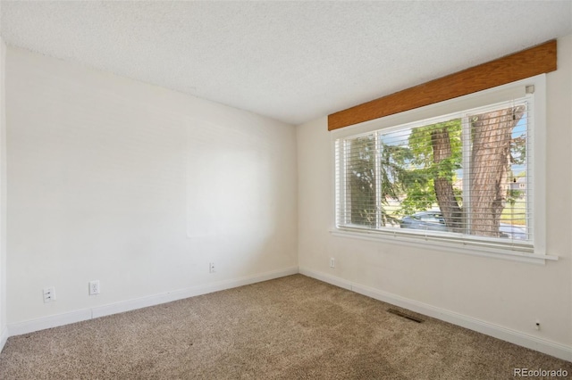 1175 Xanthia, Denver, CO 80220 - carpeted spare room featuring a textured ceiling and baseboards