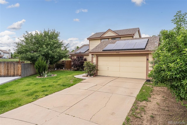 9563 Milwaukee Ct, Thornton, CO 80229 - view of front facade featuring roof mounted solar panels, driveway, an attached garage, and roof with shingles