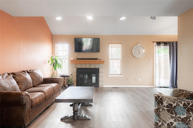 9563 Milwaukee Ct, Thornton, CO 80229 - living room with wood finished floors and a tile fireplace