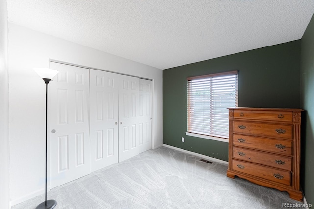 9563 Milwaukee Ct, Thornton, CO 80229 - carpeted bedroom featuring a textured ceiling and a closet