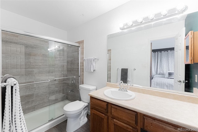 9563 Milwaukee Ct, Thornton, CO 80229 - ensuite bathroom featuring a stall shower, vanity, and wood finished floors