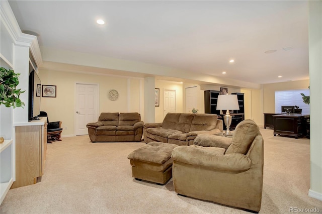 living area featuring recessed lighting, light colored carpet, and baseboards