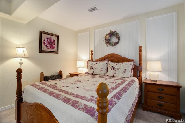 bedroom with light carpet and visible vents