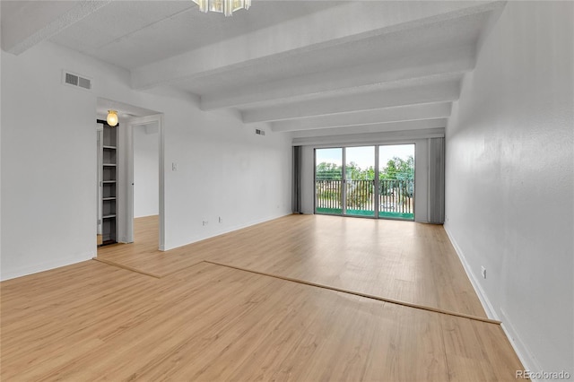 8060 E Girard Ave Unit 514, Denver, CO 80231 - spare room featuring beamed ceiling and wood finished floors