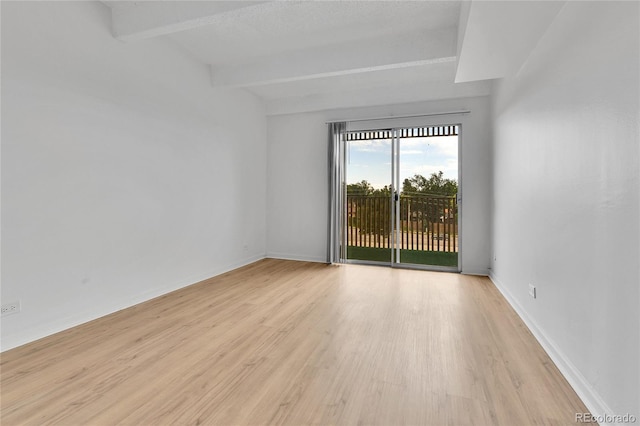 8060 E Girard Ave Unit 514, Denver, CO 80231 - unfurnished room with light wood-style flooring and beamed ceiling