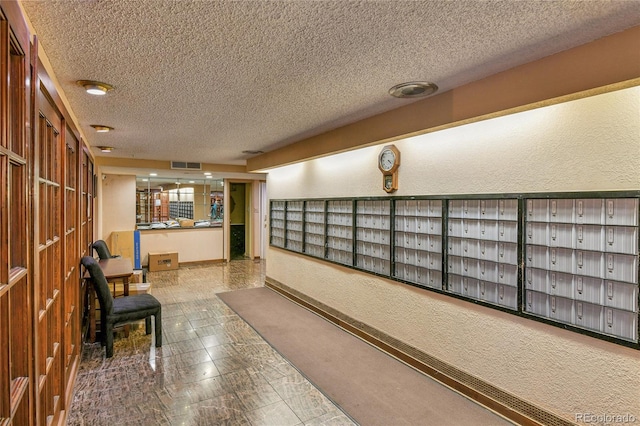 8060 E Girard Ave Unit 514, Denver, CO 80231 - community lobby featuring a textured ceiling