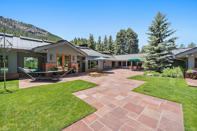 exterior space featuring a patio area and a yard