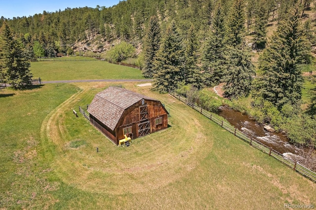 birds eye view of property featuring a rural view