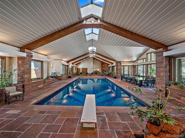 view of pool featuring a patio and a diving board