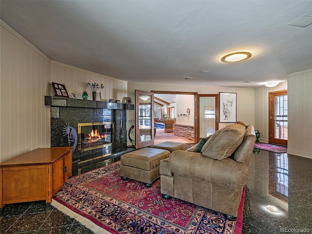 living room featuring dark tile floors