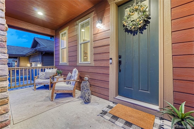 doorway to property featuring covered porch