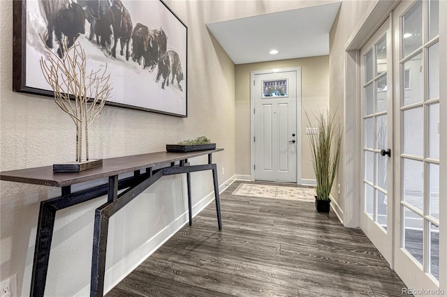 foyer entrance featuring recessed lighting, baseboards, wood finished floors, and french doors