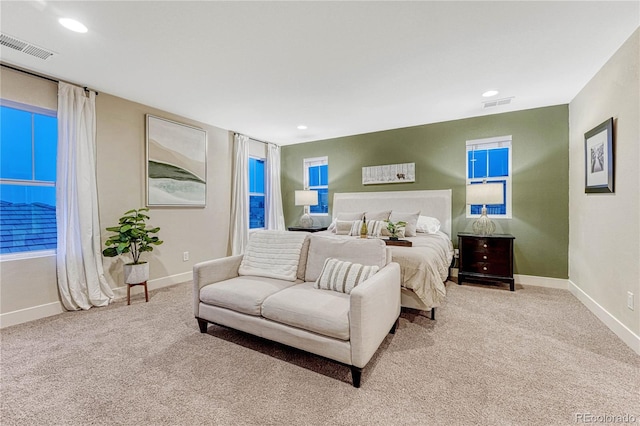 carpeted bedroom featuring recessed lighting, visible vents, and baseboards