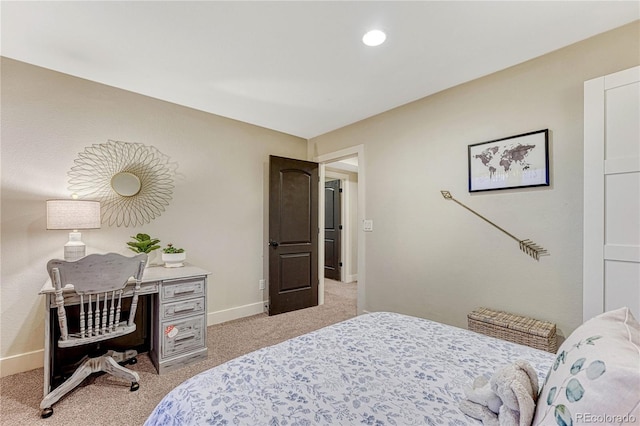 bedroom featuring light colored carpet and baseboards