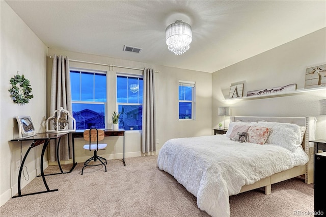 bedroom featuring baseboards, visible vents, carpet flooring, and an inviting chandelier