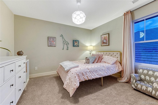 bedroom with light carpet, visible vents, and baseboards