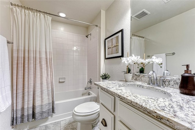 full bathroom with shower / tub combo with curtain, visible vents, toilet, vanity, and tile patterned flooring