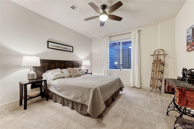 bedroom with ceiling fan, baseboards, visible vents, and light colored carpet