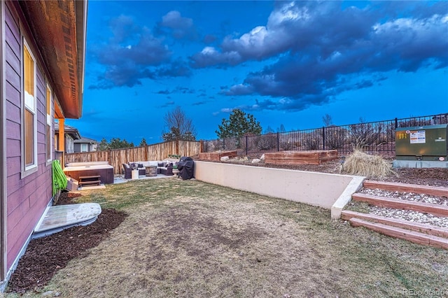 view of yard featuring a patio area, outdoor lounge area, a fenced backyard, and a hot tub