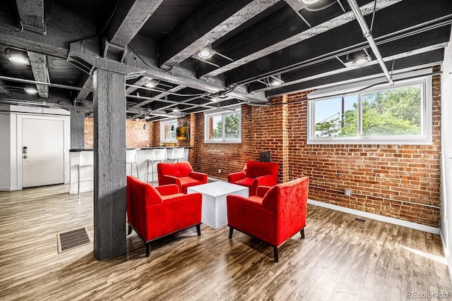 201 Lamkin St Unit 204, Pueblo, CO 81003 - below grade area featuring brick wall and wood finished floors