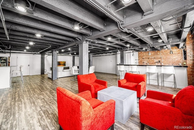201 Lamkin St Unit 204, Pueblo, CO 81003 - finished basement featuring brick wall and wood finished floors