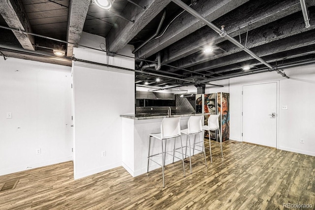 201 Lamkin St Unit 204, Pueblo, CO 81003 - finished basement featuring wood finished floors and bar area