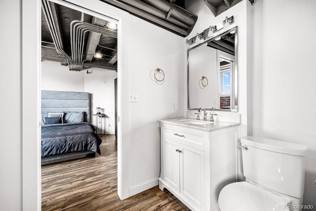 201 Lamkin St Unit 204, Pueblo, CO 81003 - half bathroom with wood finished floors, vanity, and ensuite bath